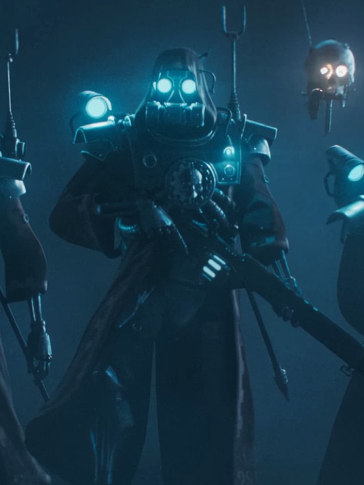Warhammer 40,000: Darktide - Three Skitarii Class NPCs wearing long jackets and holding guns walking toward the camera