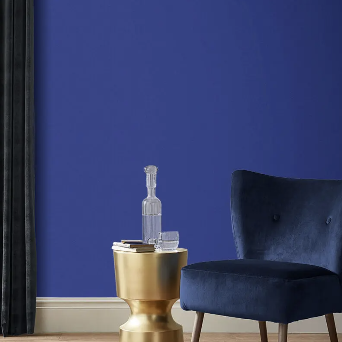 Blue painted wall with blue chair in front