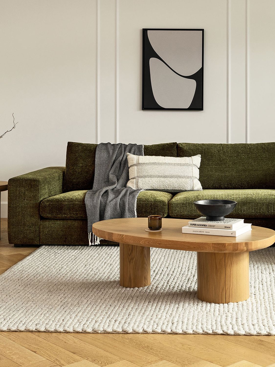 green velvet sofa in a white room