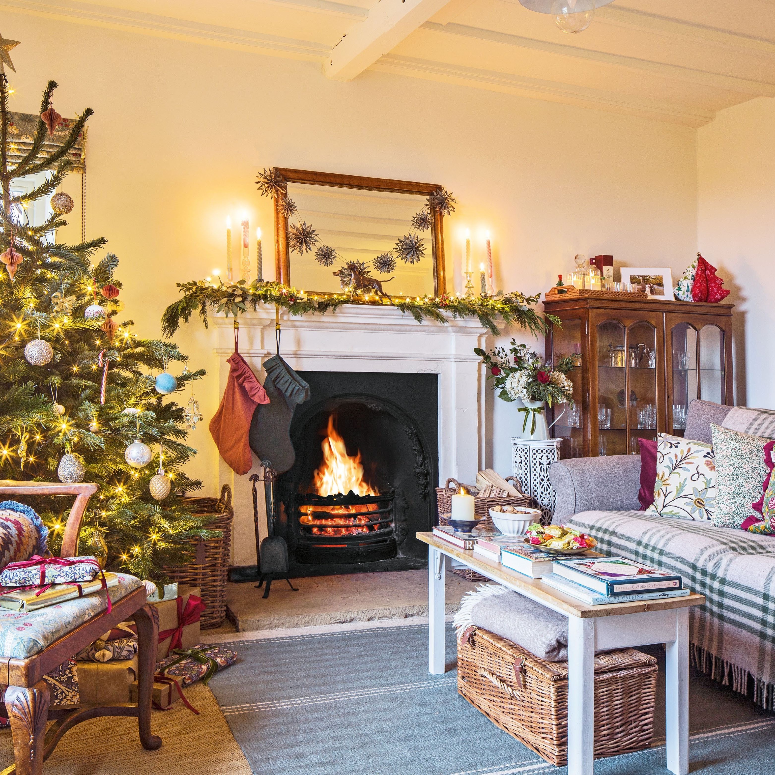 living room in a farmhouse with real fire and Christmas tree
