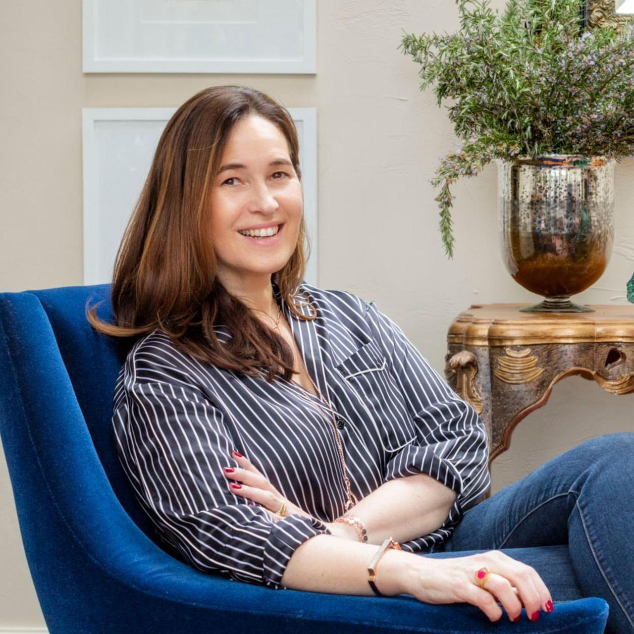 Monica Vinader in a blue armchair