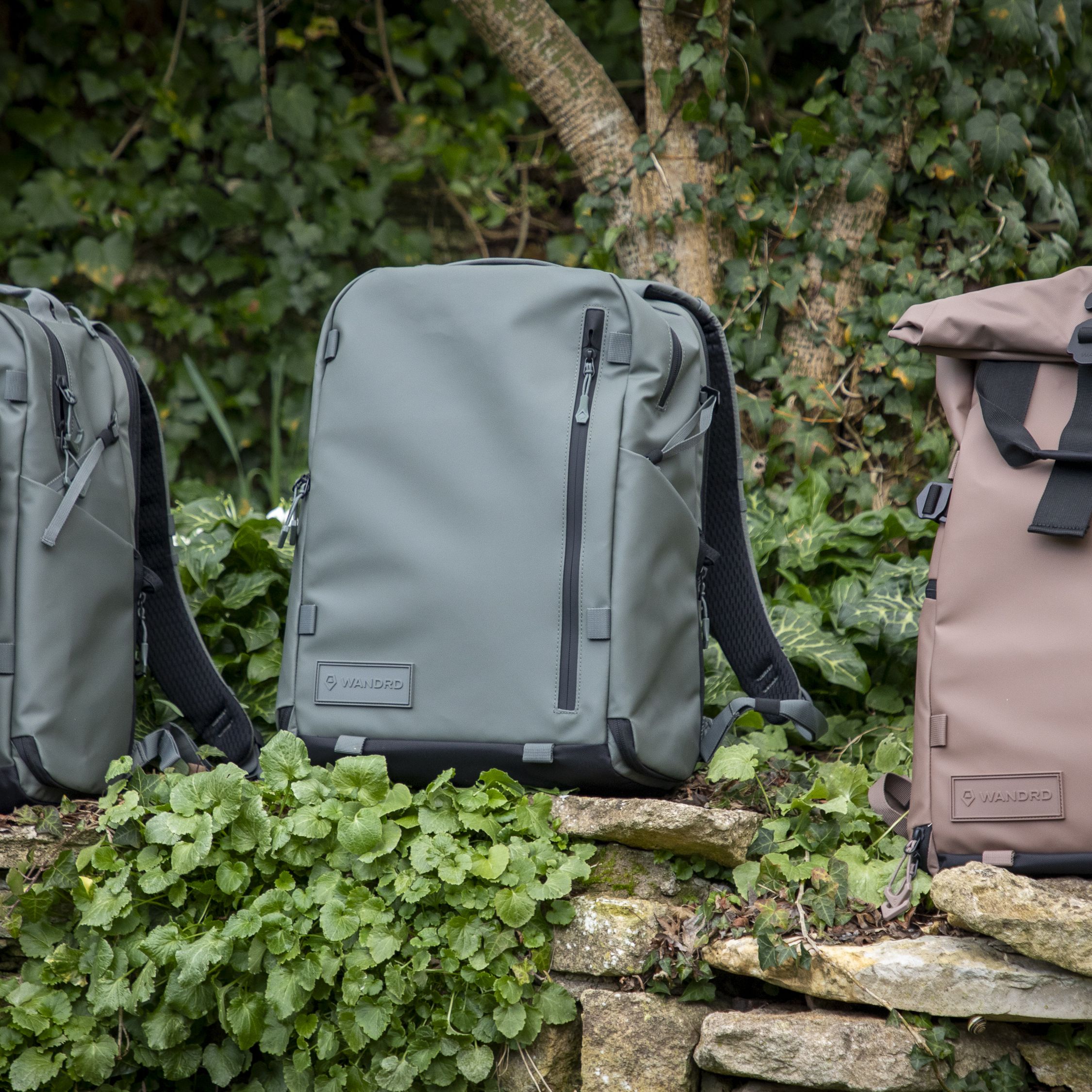 That trendy roll-top camera backpack has two new zip-up siblings