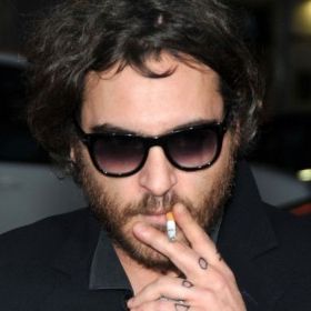 what cigarettes does joaquin phoenix smoke smokes "American Spirit" cigarette underneath a "No Smoking" sing, on the terrace Actor turned rapper, Joaquin Phoenix,