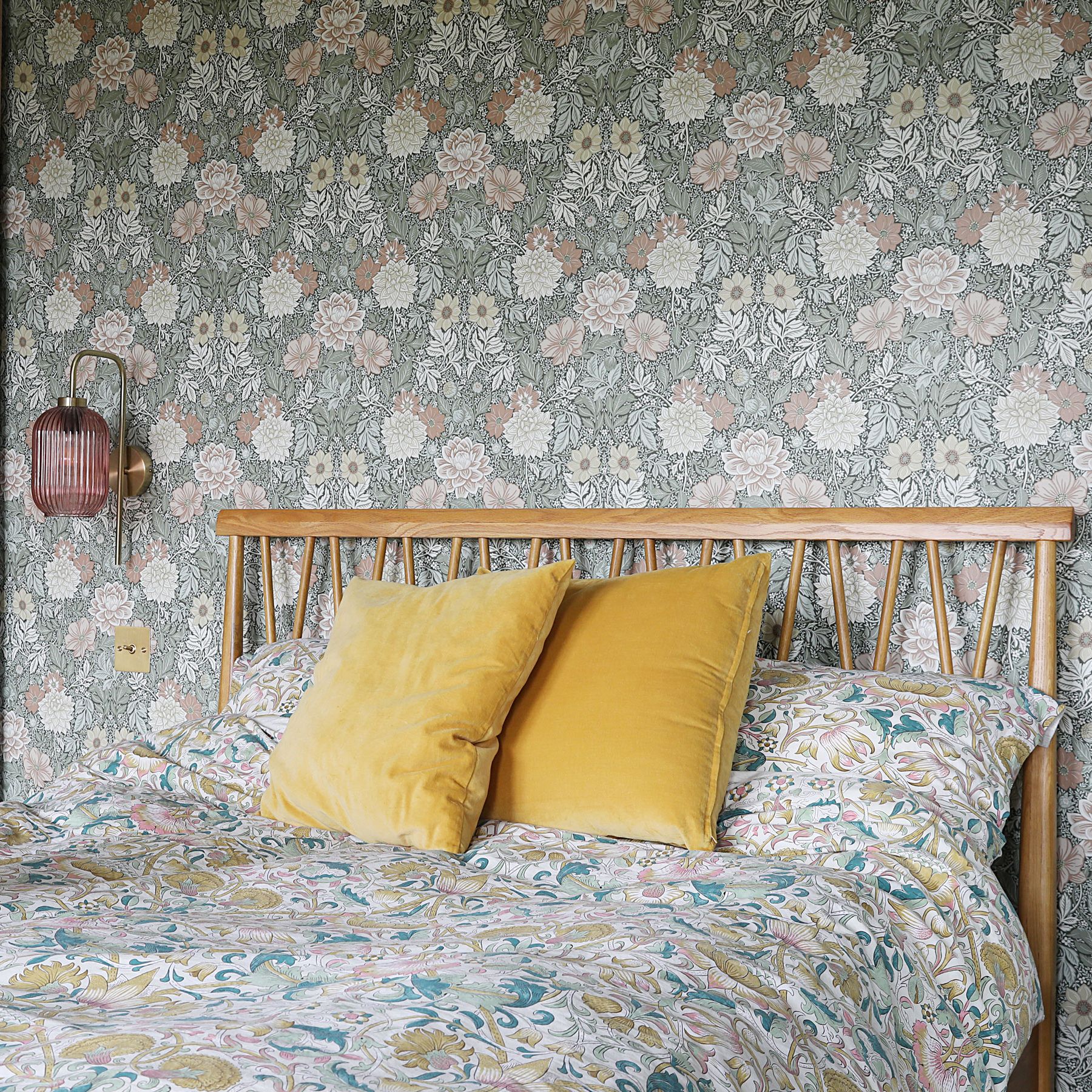 Floral wallpaper with scandi bed and floral bedding