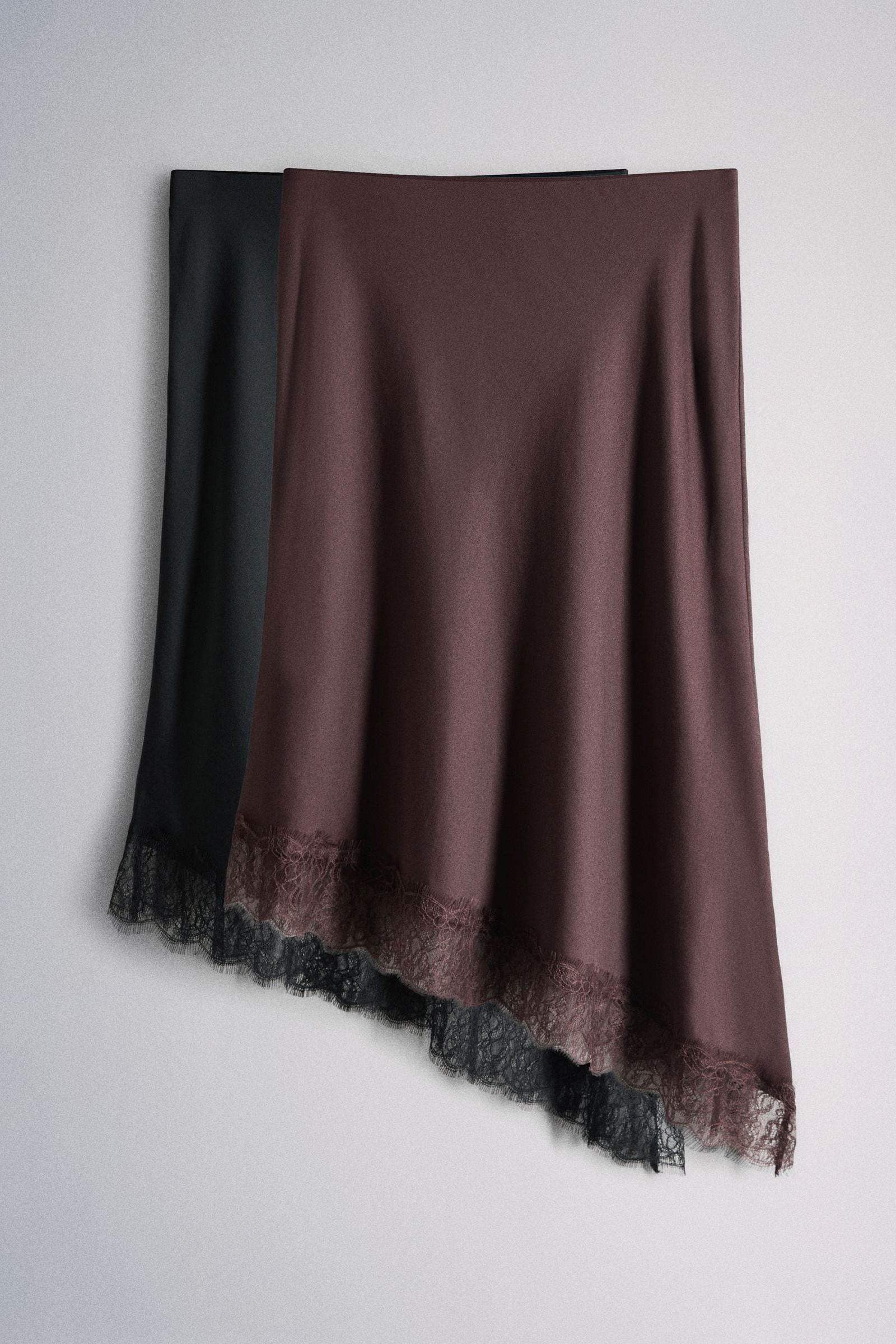 The Set 2 Pack Satin Crepe Lace Hem Asymmetric Midi Skirts Black/plum