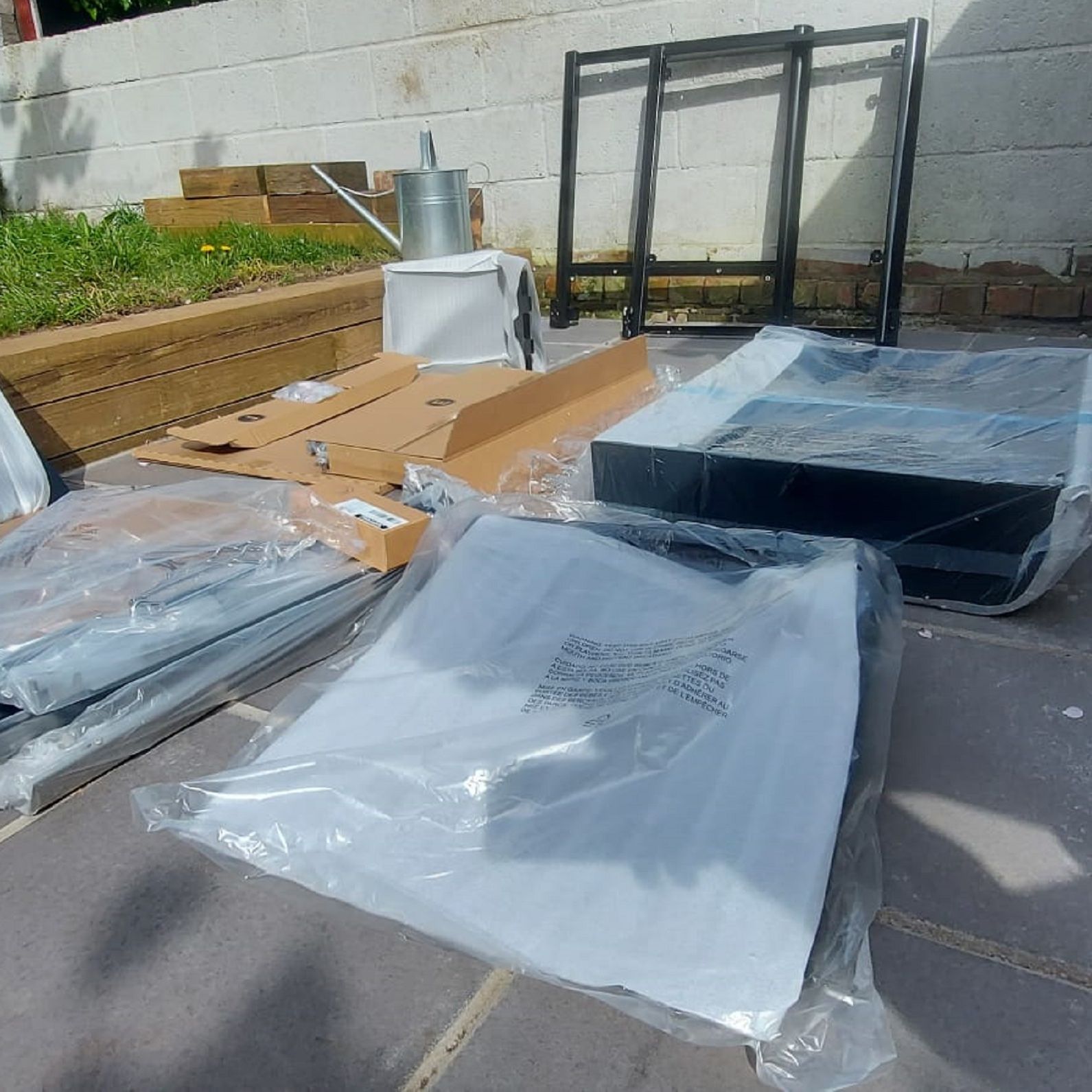 laying out the weber genesis ex335 on the ground prior to assembly