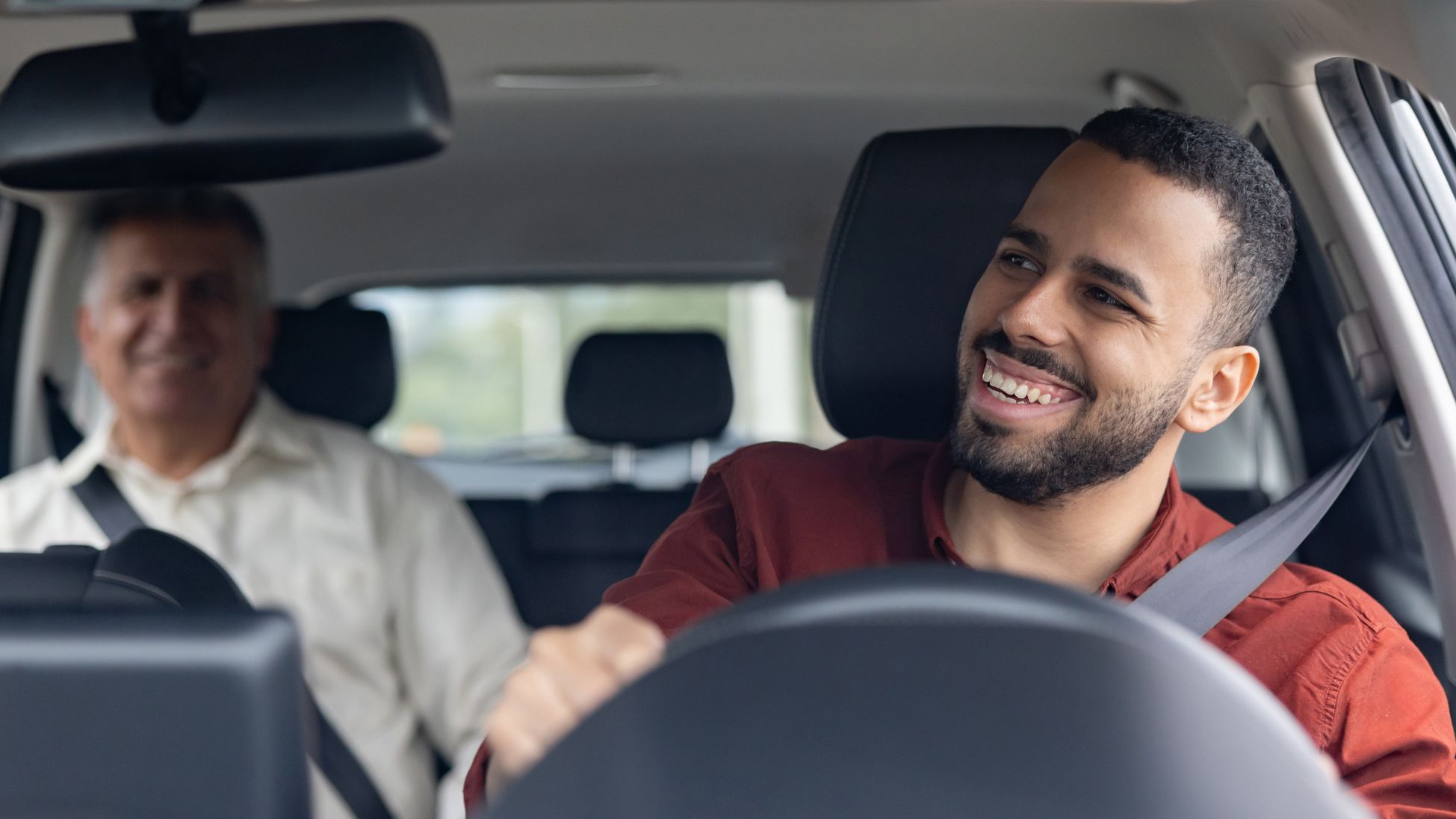an Uber driver chats with a passenger