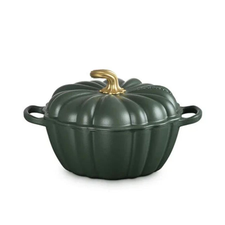 A dark green Le Creuset pumpkin dutch oven