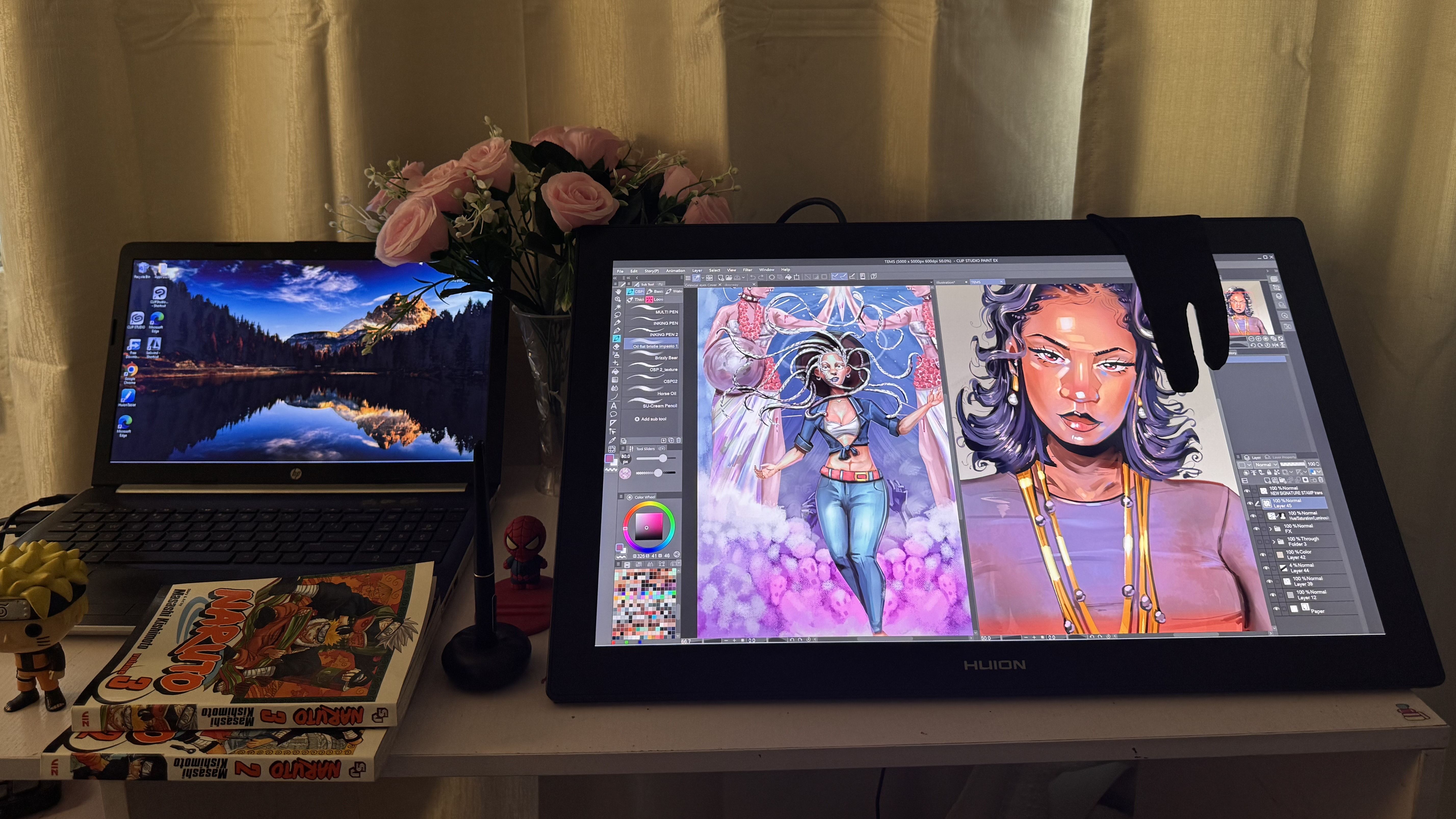 drawing tablets; a tablet screen showing a cartoon of a woman