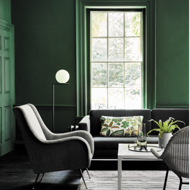 Sitting room painted in puck green by Little Greene
