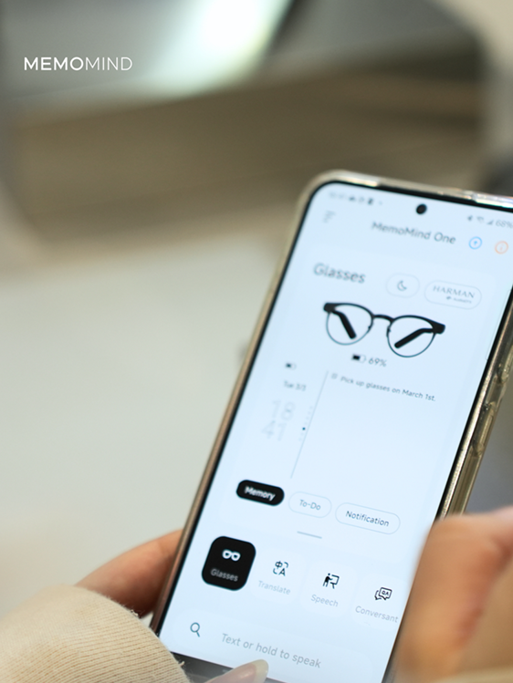 Mobile phone showing MemoMind One app UI
