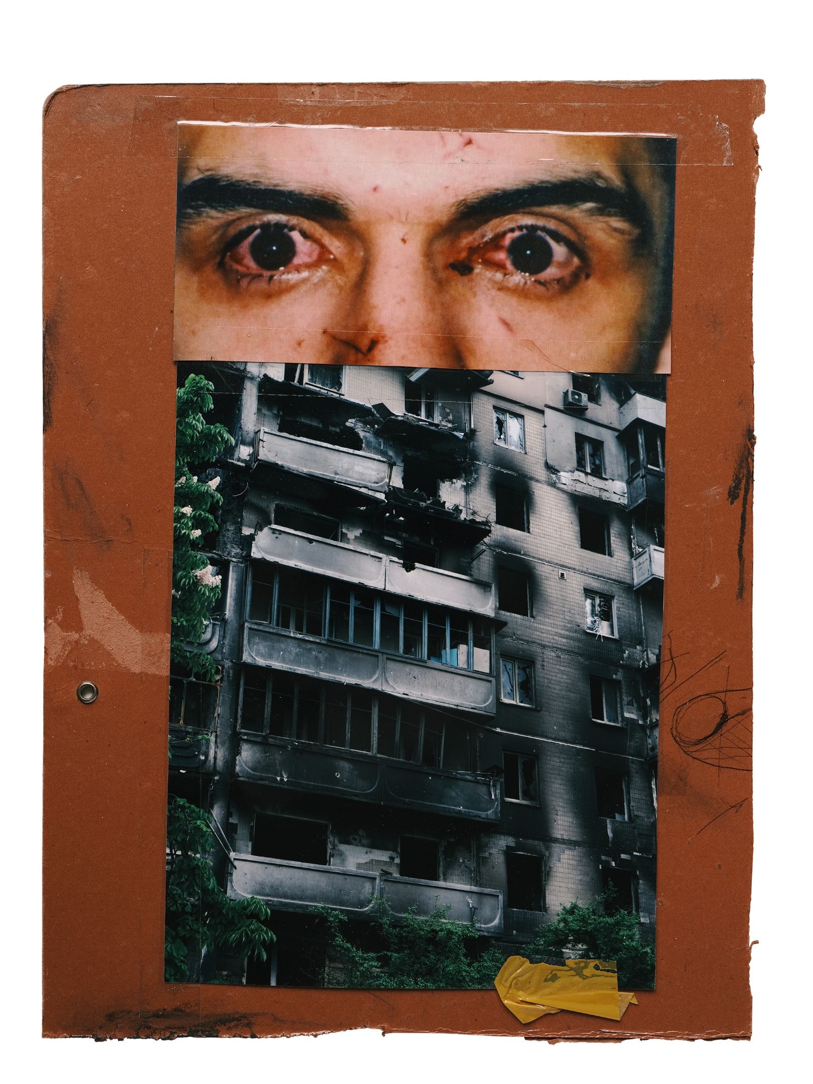 A collage on brown card pairing a close-up of bloodshot eyes with a burnt-out apartment block.