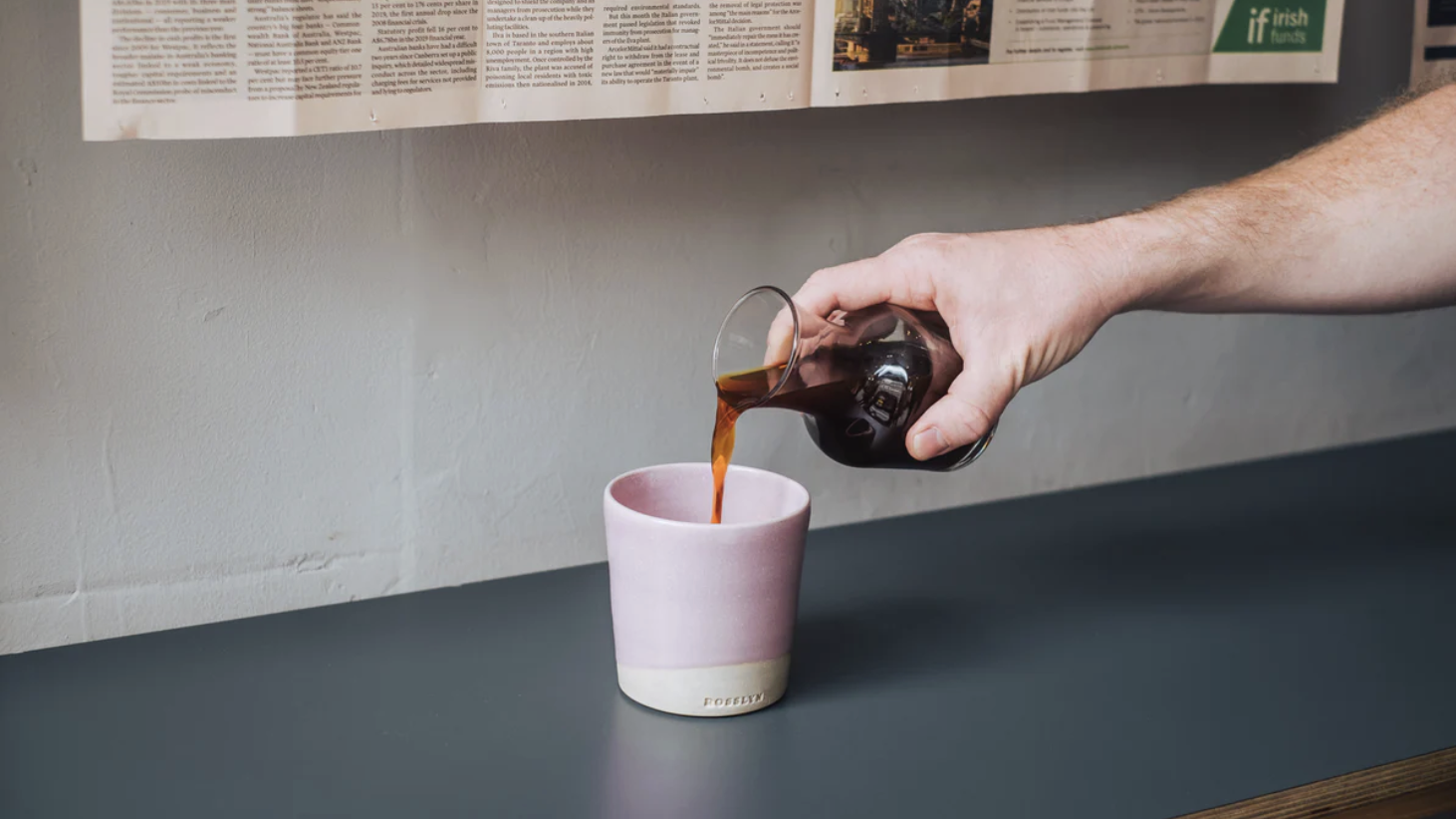 an image of espresso being poured into a handmade ceramic cup at Rosslyn coffee shop
