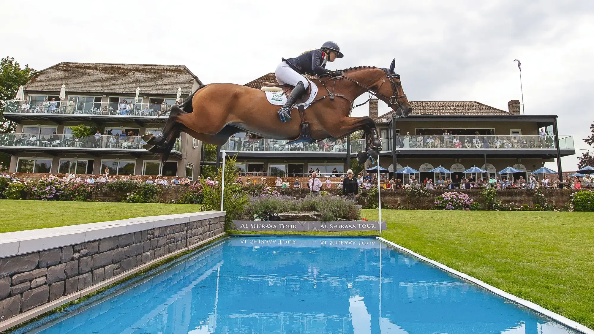 Jess Mendoza and Summerhouse jumping the water at Hickstead in The Agria Nations Cup of Great Britain