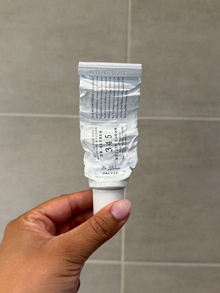 Aleesha holding empty Dr Althea 345 Cream