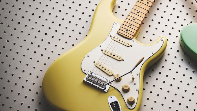 A yellow Stratocaster and green Telecaster Fender Player II guitars