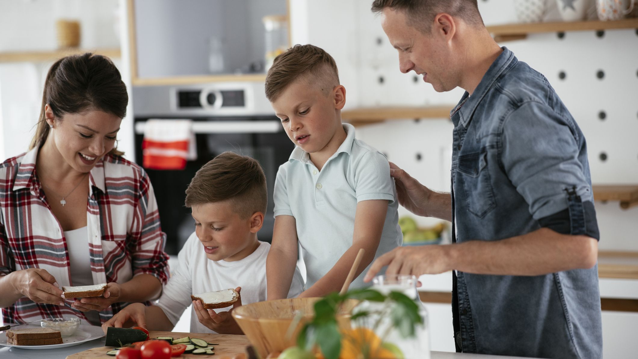 A family making lunch at home together