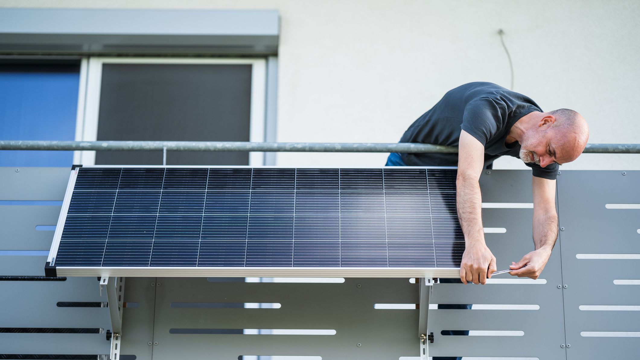 Man working on solar panel