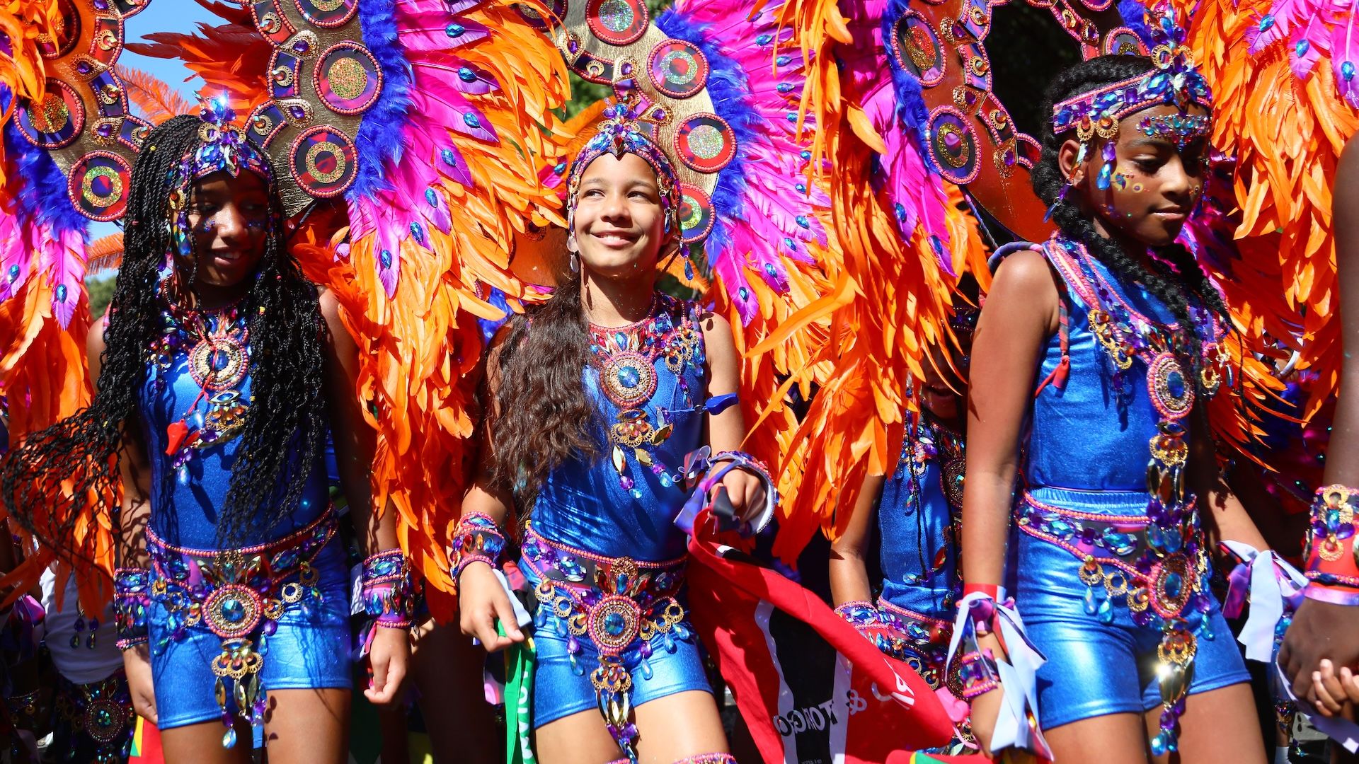 LONDON, ENGLAND - AUGUST 24: Revellers attend Notting Hill Carnival on August 24, 2025 in London, England. The Notting Hill carnival was established in 1959 to foster community cohesion after racial violence towards the West Indian migrant population that resulted in murder. Trinidadian human rights activist Claudia Jones organised the first indoor Caribbean Carnival at St Pancras Town Hall, where the event featured music, masques, and calypso performers and was broadcast on the BBC. In 1966, local social worker Rhaune Laslett brought the festival to the street, creating the foundation for the Notting Hill Carnival we know today. The Notting Hill Carnival is Europe's Largest Street festival and remains a community-led event, celebrating Caribbean culture and bringing diverse communities together through Sound Systems, floats, costumes and dancing. (Photo by Alishia Abodunde/Getty Images)