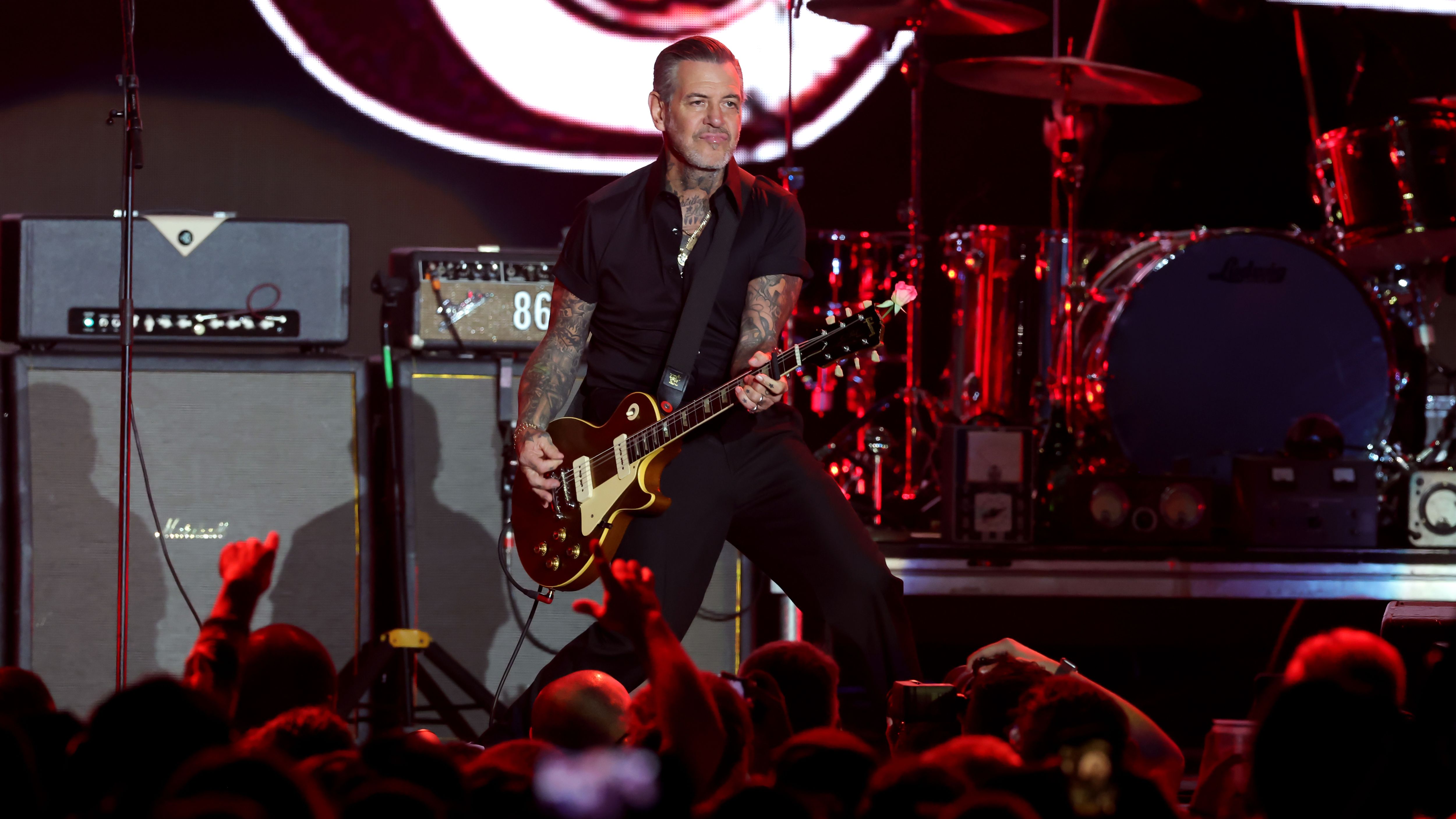 INGLEWOOD, CALIFORNIA - DECEMBER 13: Mike Ness of Social Distortion performs onstage during the 2025 KROQ Almost Acoustic Christmas at The Kia Forum on December 13, 2025 in Inglewood, California. (Photo by Kevin Winter/Getty Images for Audacy)