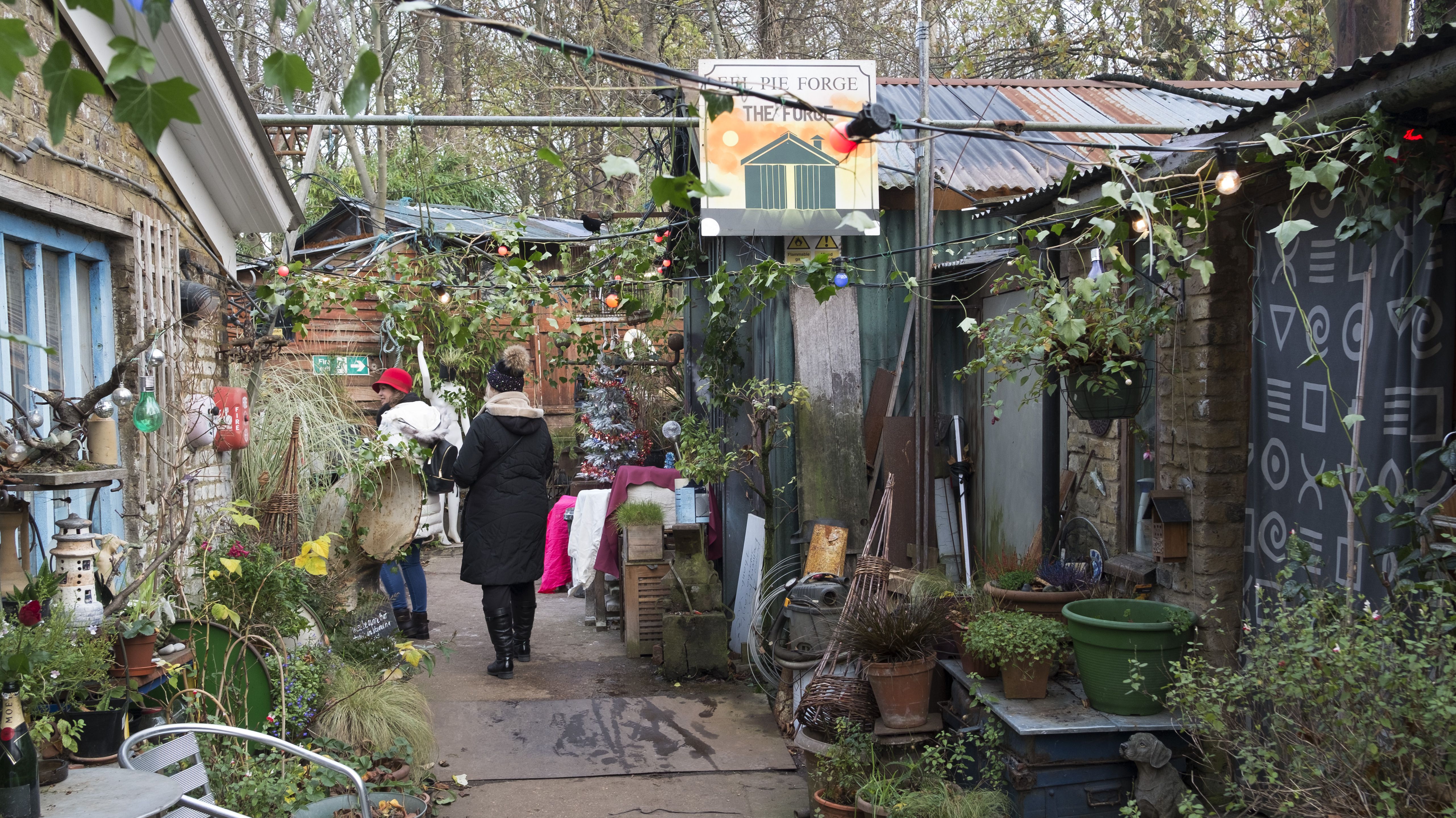 an image of an ecclectic collection of objects outside an artist studio on Eel Pie Island in London