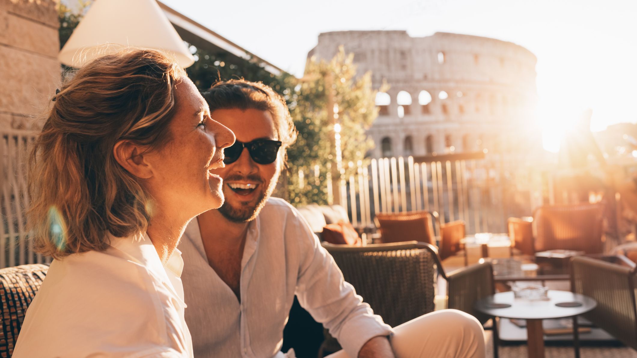 a couple sitting at a cafe in Rome