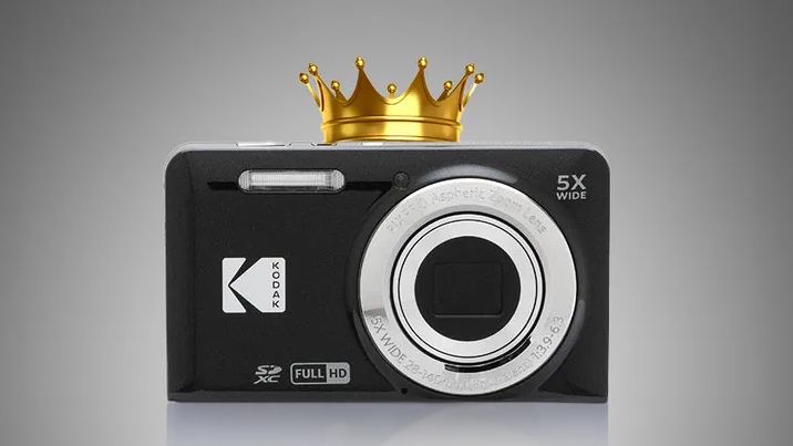 Three Kodak PixPro FZ55 compact camera in with a gold crown above the black camera against a gray backdrop