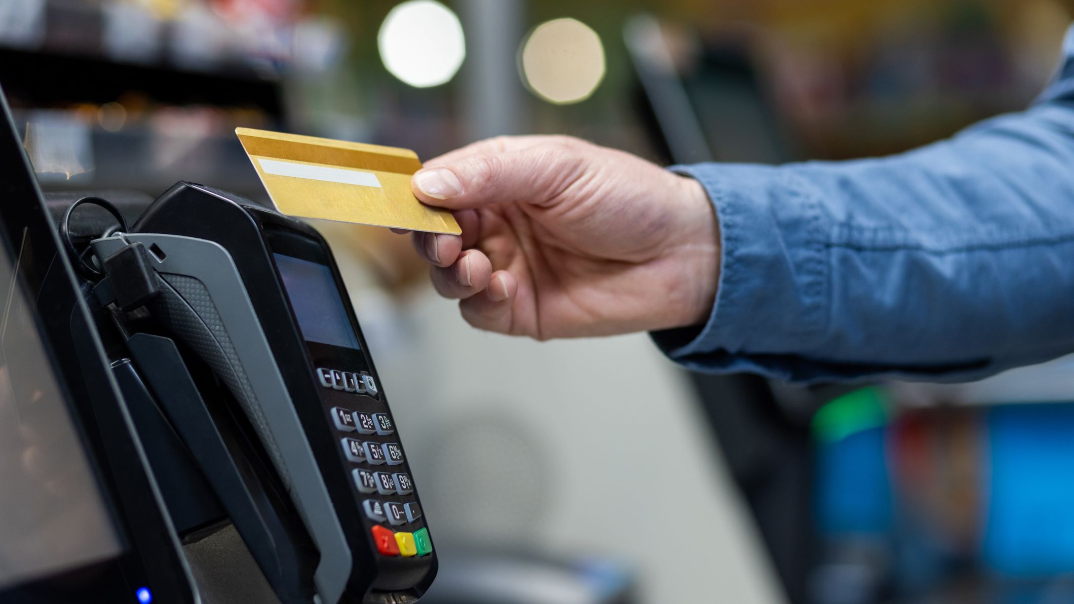 A shopper paying with credit card
