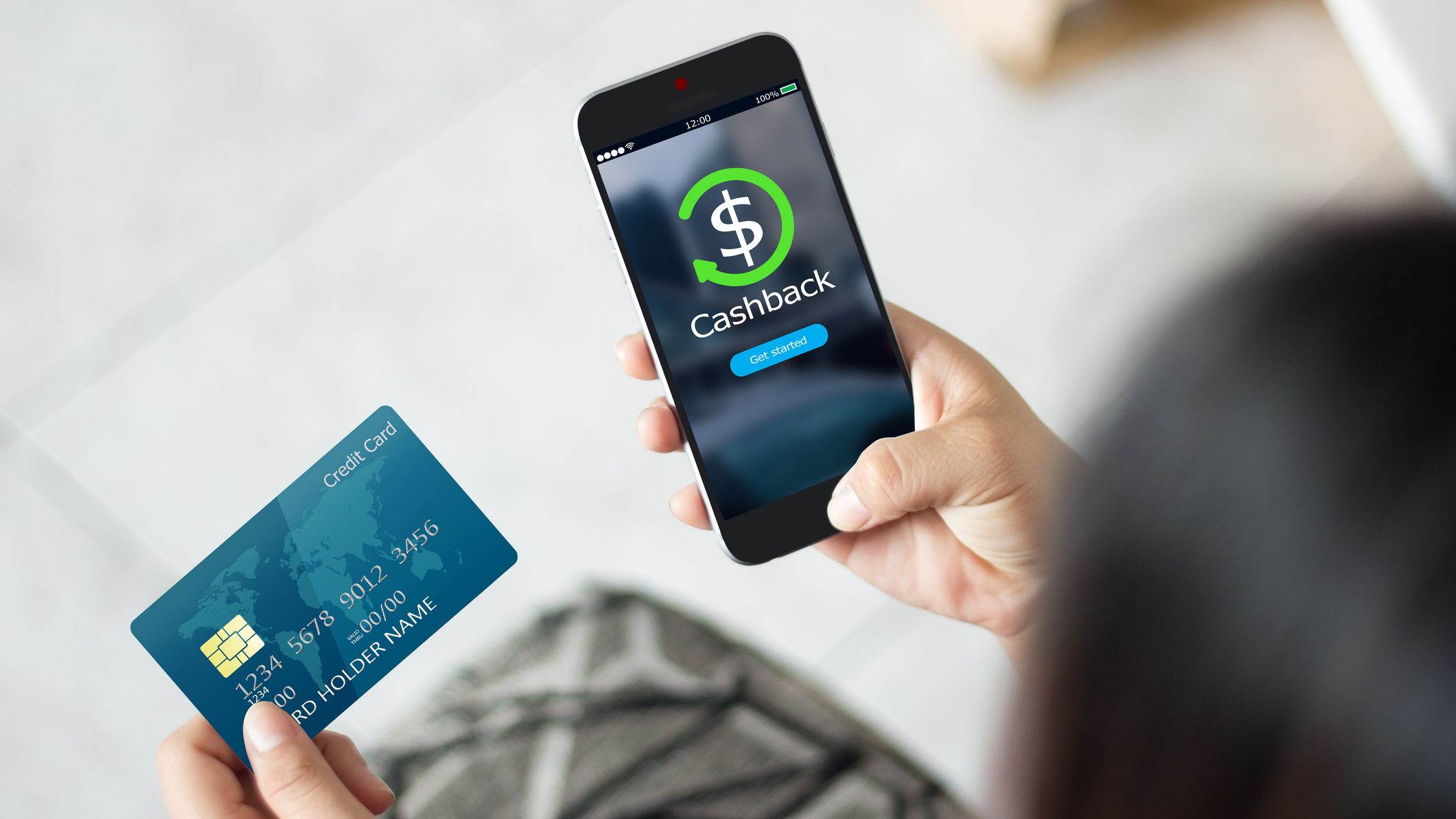 Female hands using mobile phone and holding credit card