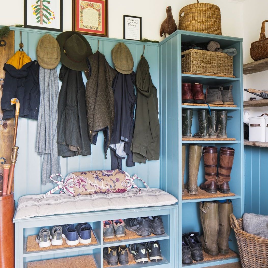 Boot room with duck egg blue painted shelving and wall panelling