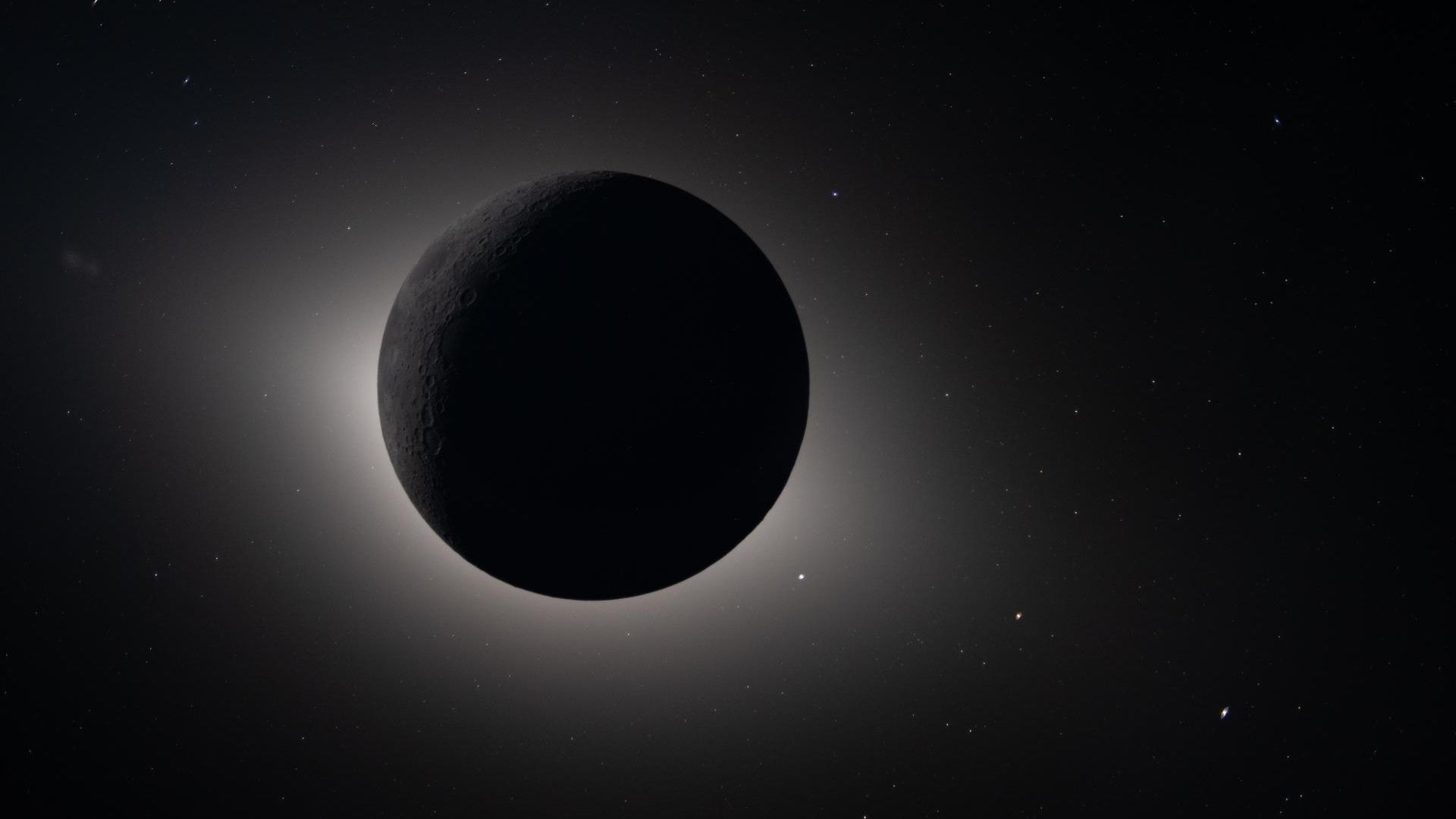 The moon is pictured silhouetted against the blackness of space during a total solar eclipse captured by NASA's Artemis 2 spacecraft.