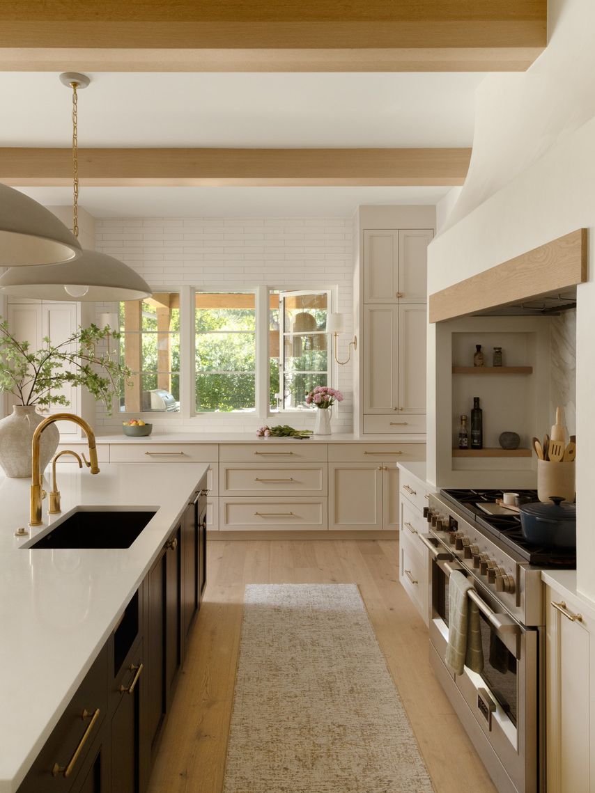 Neutral kitchen with dark coloured island