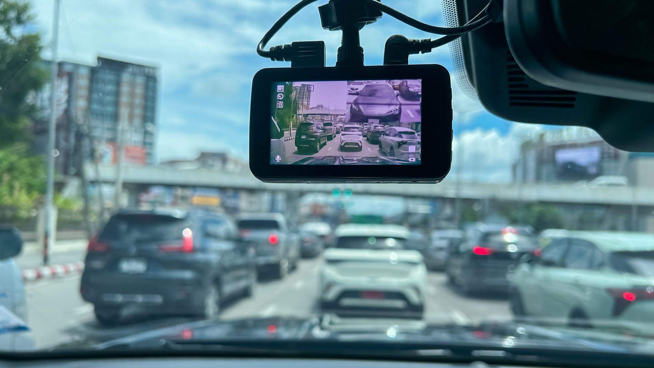a dash cam displays traffic in front of the car