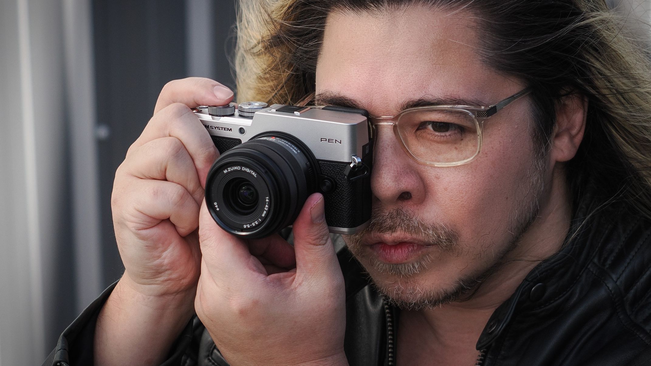 James Artaius shooting with the OM System PEN and the OM System M.Zuiko 14-42mm f/3.5-5.6 III in an urban setting