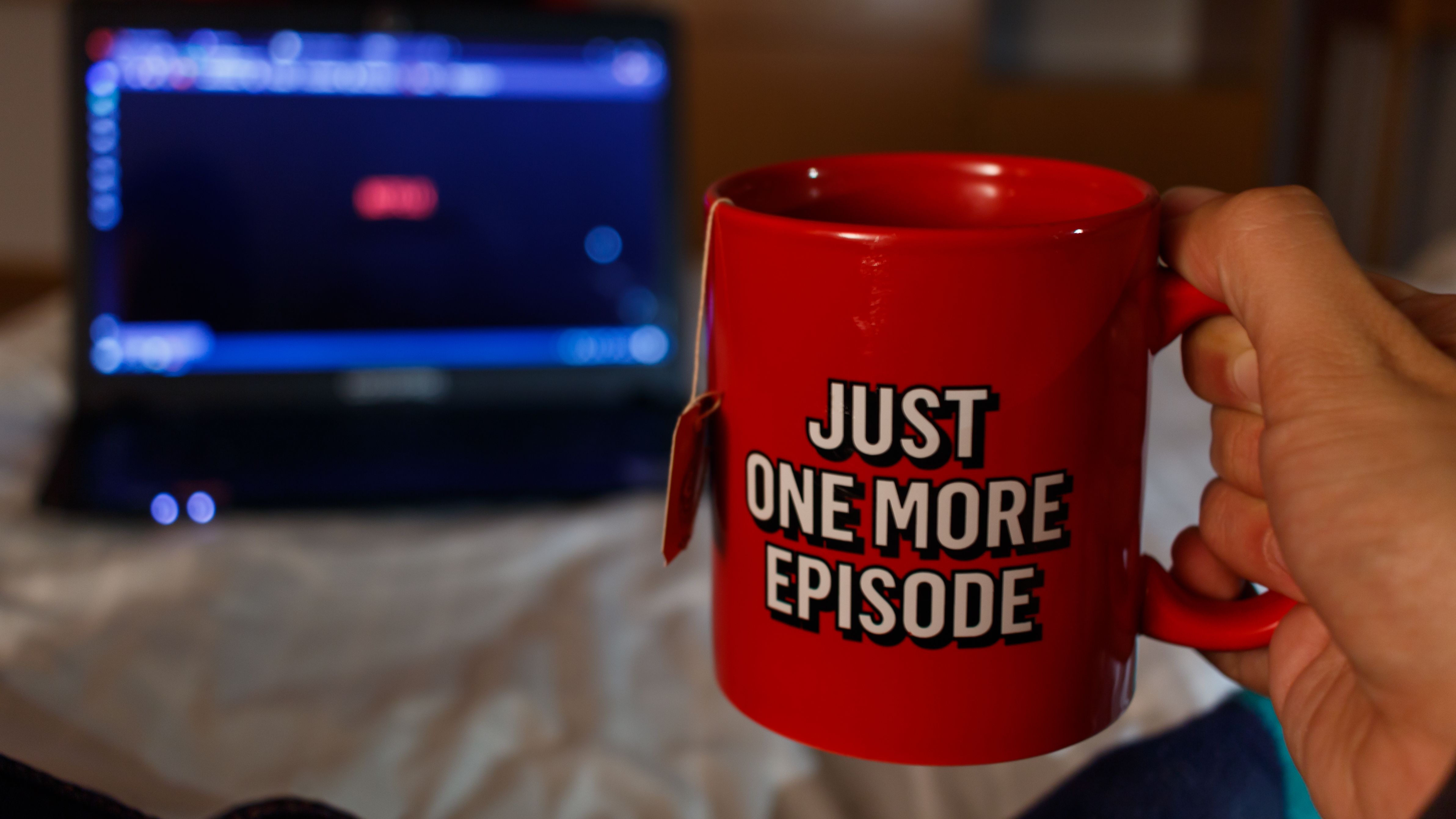 Just one more episode logo on a red mug