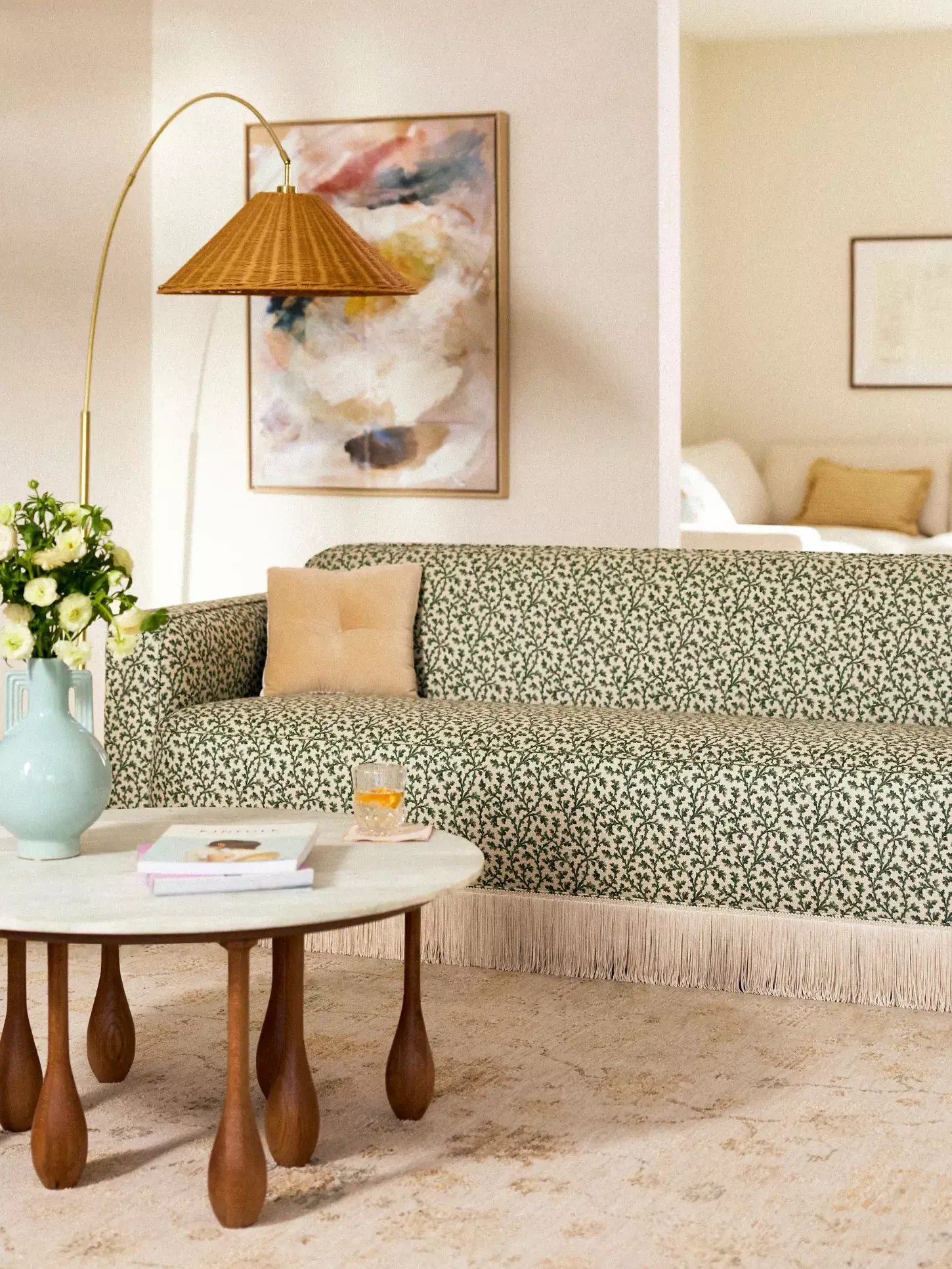 floral fringe sofa in a boho living room