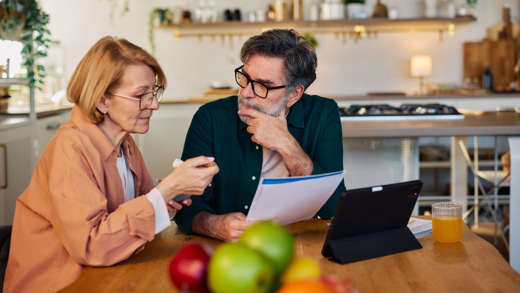 Older couple discussing a budget