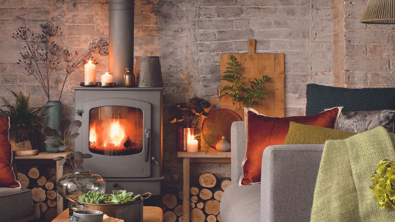 Cozy living room with log-burning stove to show how to keep a house warm in winter