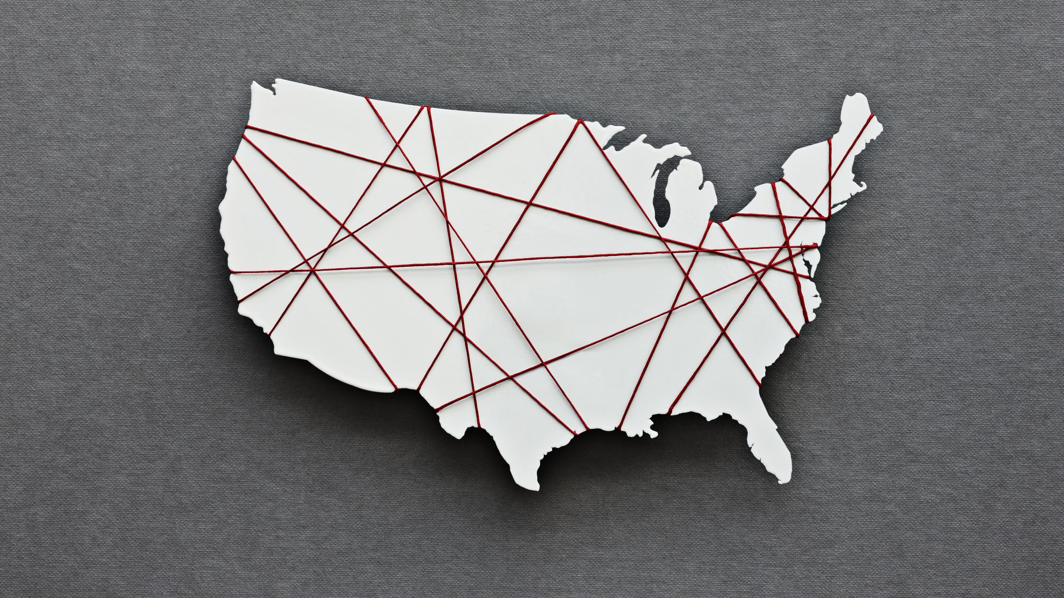 Map of the US wrapped in red thread