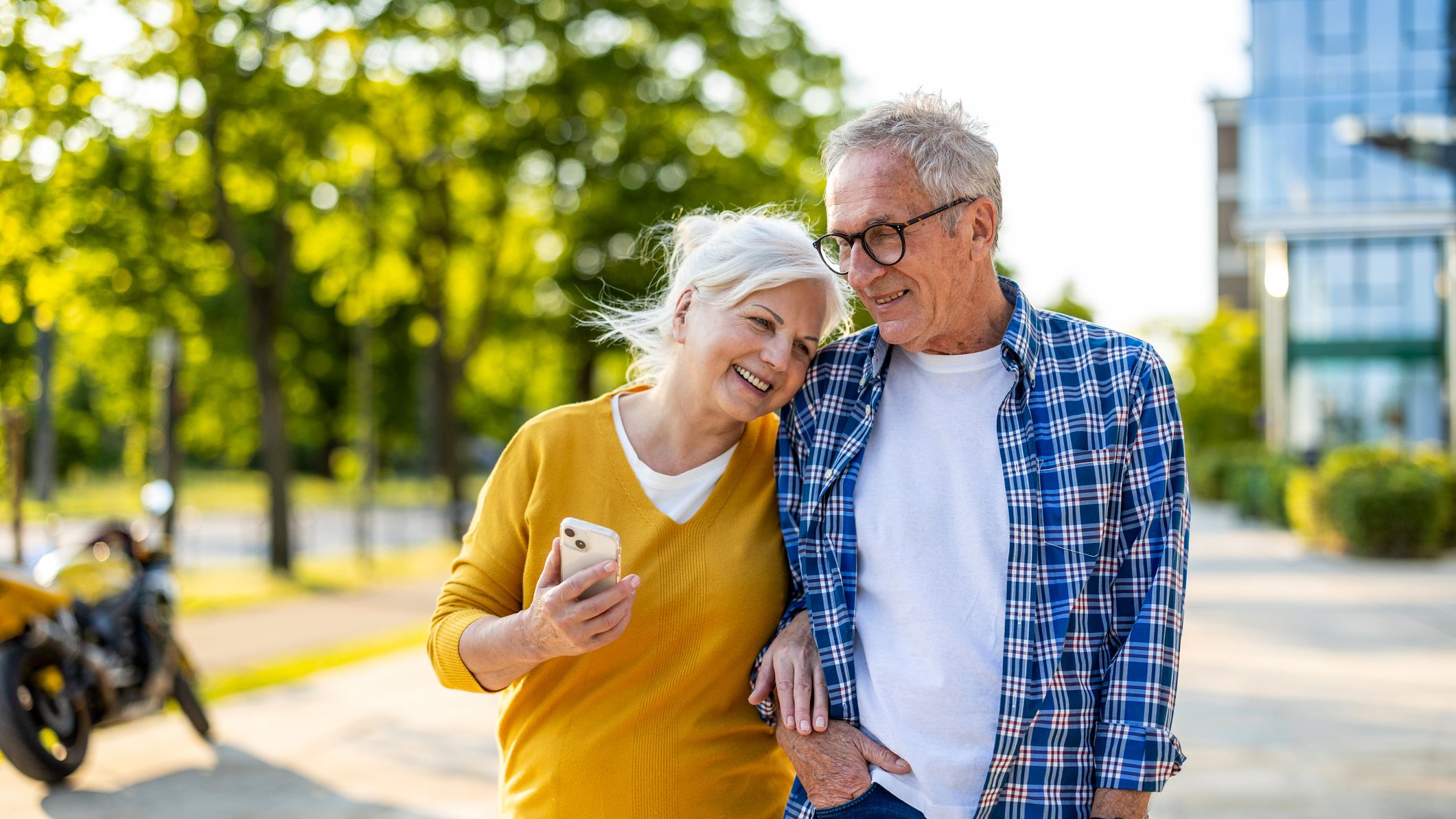 Older couple walking in a city