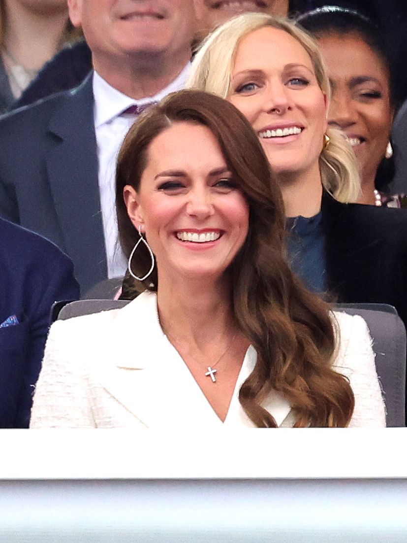 LONDON, ENGLAND - JUNE 04: Catherine, Duchess of Cambridge and Princess Charlotte of Cambridge watch Paddington Bear and HM The Queen on screen during the Platinum Party at the Palace in front of Buckingham Palace on June 04, 2022 in London, England. The Platinum Jubilee of Elizabeth II is being celebrated from June 2 to June 5, 2022, in the UK and Commonwealth to mark the 70th anniversary of the accession of Queen Elizabeth II on 6 February 1952. (Photo by Chris Jackson/Getty Images)