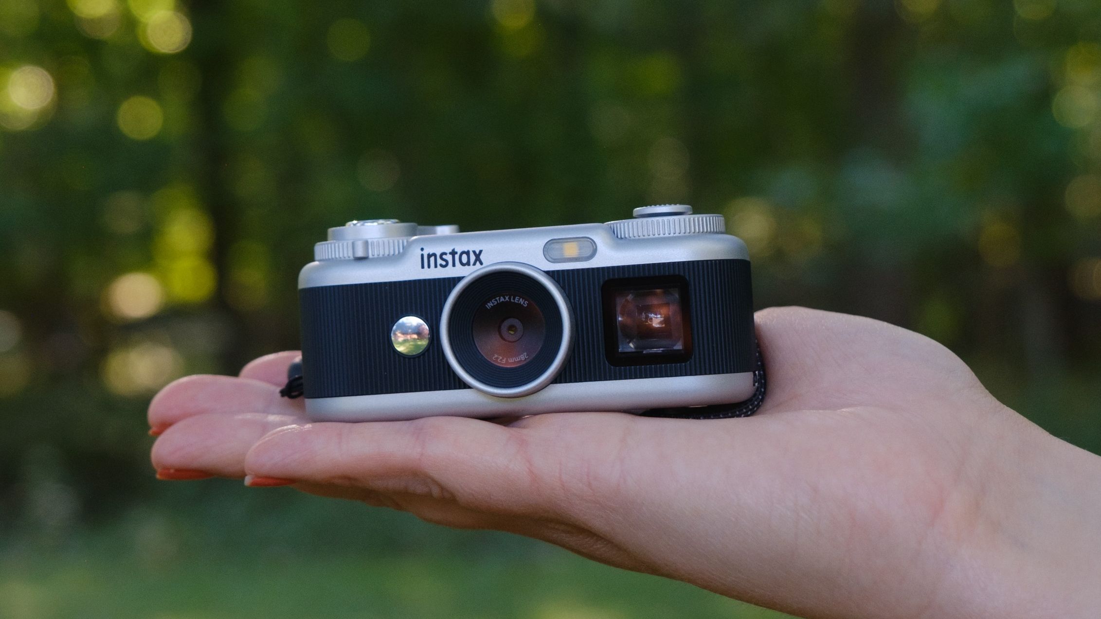 The Instax Pal 2 in a photographer's hands