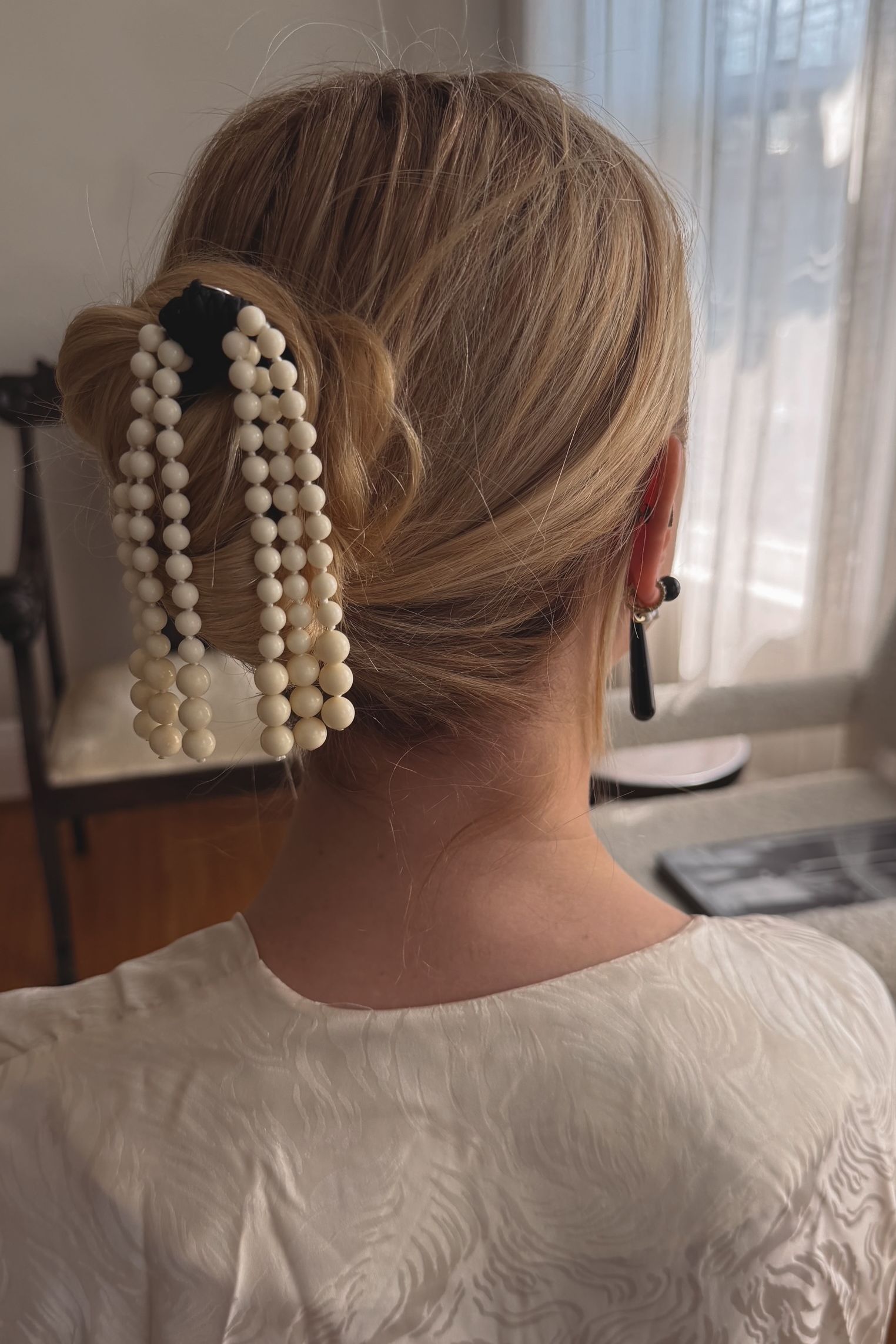 Kerry Pieri shows off a pearl hair piece by Mosquito