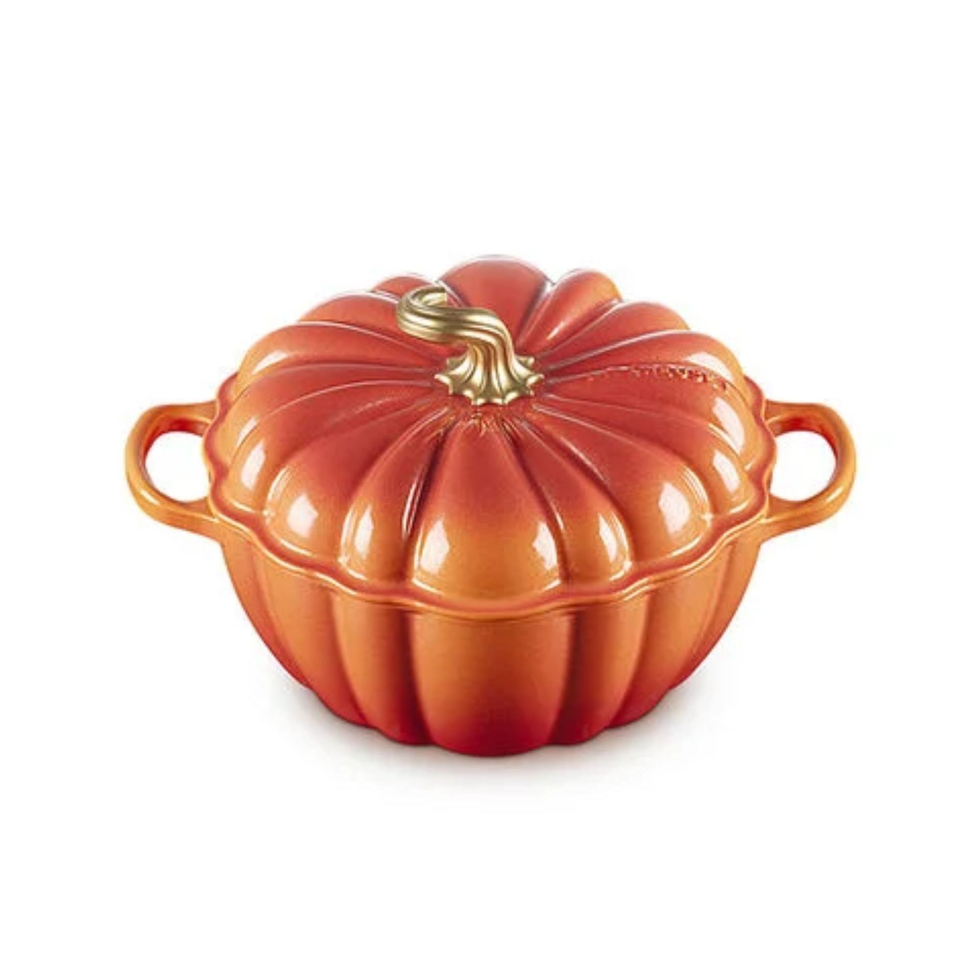 A glazed orange pumpkin shaped baking dish with with a handle either side.