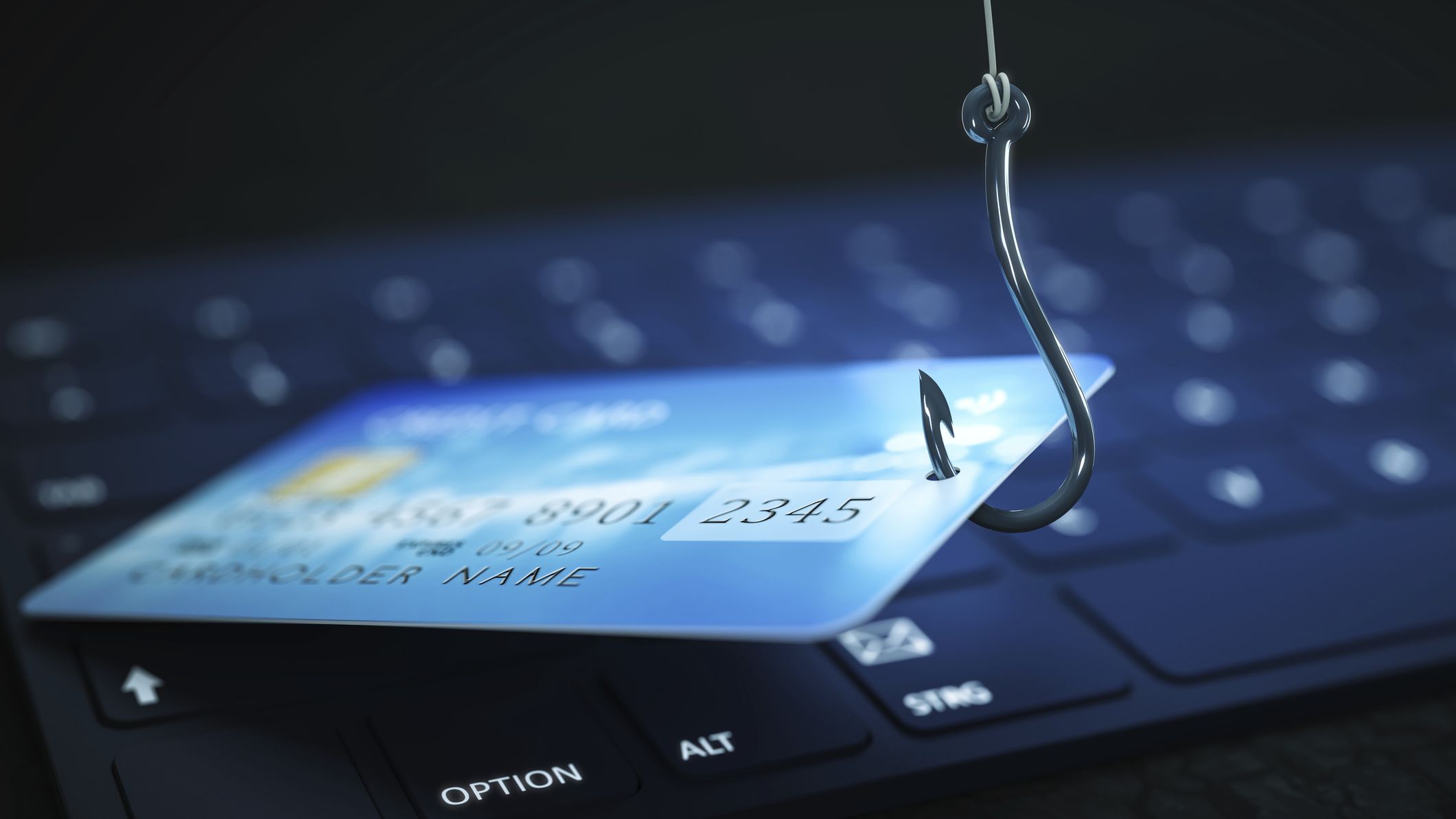 Phishing credit card data with keyboard and hook symbol