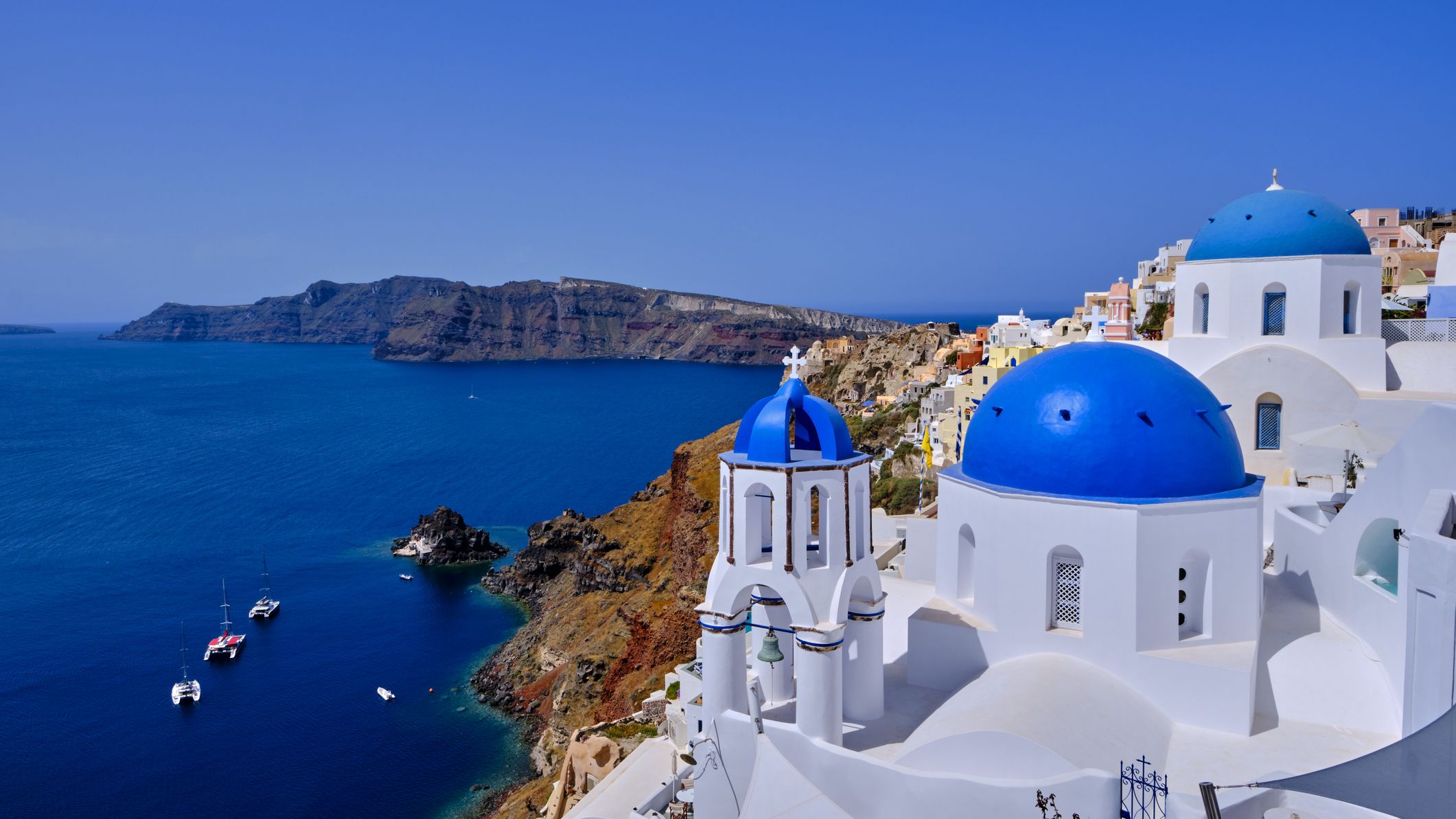 Iconic blue rooftops of Santorini, Greece, over the caldera.