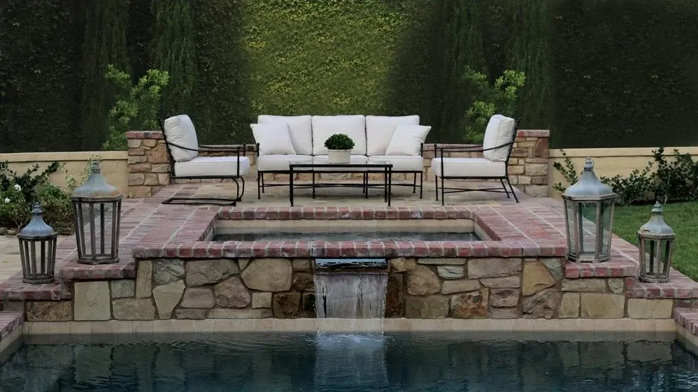 patio furniture overlooking a pool