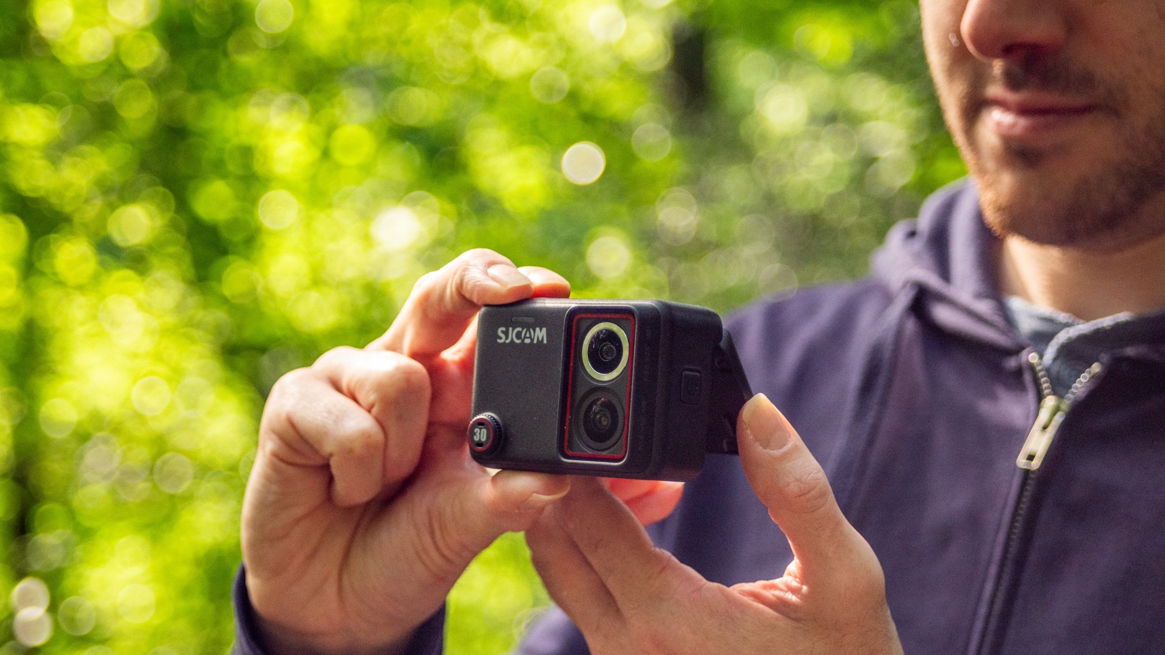Man holding the SJCAM SJ30 action camera