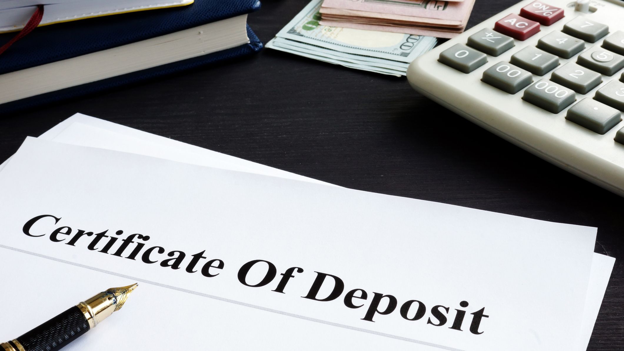 Certificate of deposit and pen in the office.