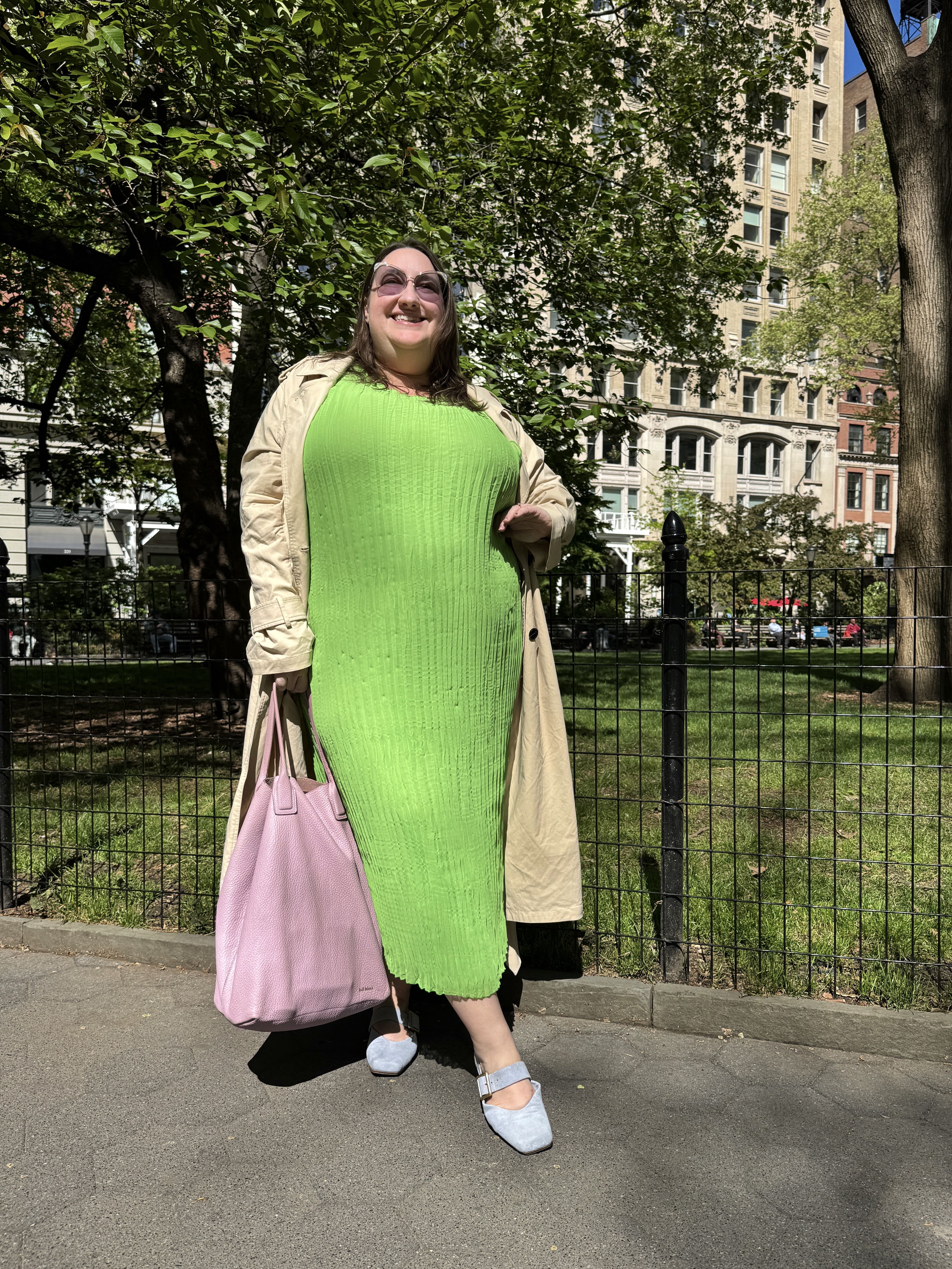 Sarah Chiwaya pairs her lime green dress with a pink bag and powder blue shoes